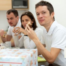team at lunch smiling